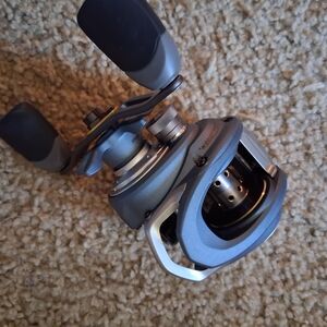 Blue and Silver Baitcasting Reel - Brand: